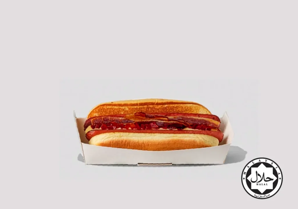 Beef sausage in a toasted potato bun, topped with cheese sauce, cherry peppers, applewood-smoked streaky beef